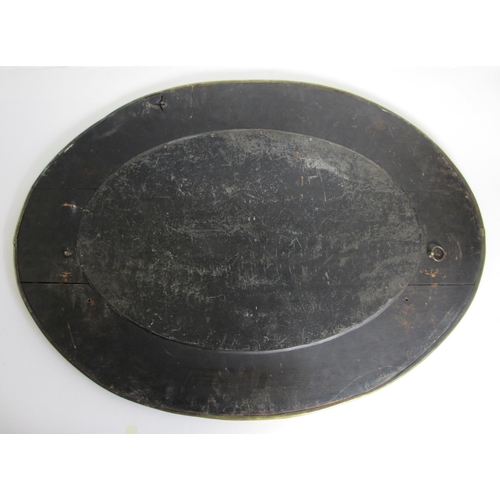 773 - A Glasgow style embossed brass oval wall mirror