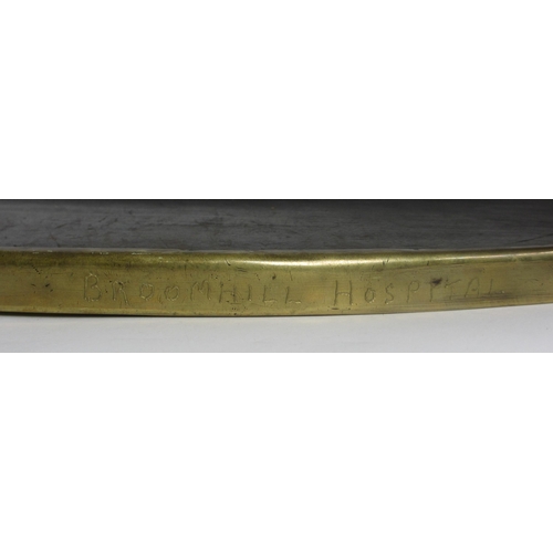 773 - A Glasgow style embossed brass oval wall mirror