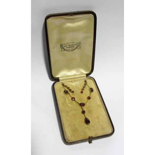 79 - A Victorian gold garnet pendant necklace and earrings