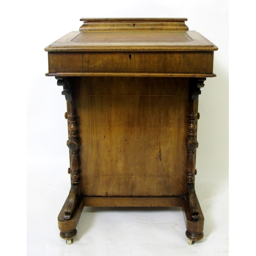 825 - A Victorian walnut inlaid Davenport desk