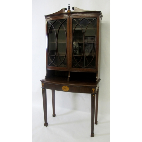 832 - An Edwardian mahogany bookcase on table base in the Sheraton manner