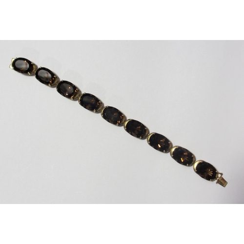 84 - A gold smoky quartz bracelet