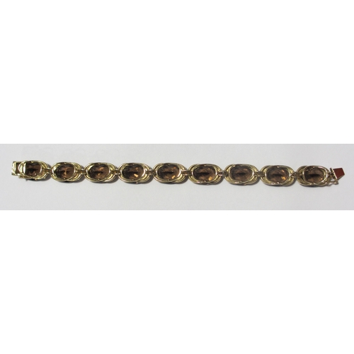 84 - A gold smoky quartz bracelet