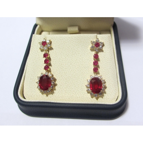 95 - A fine pair of ruby and diamond pendant earrings