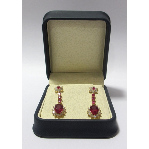 95 - A fine pair of ruby and diamond pendant earrings