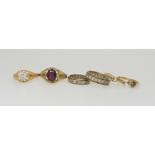 691 - Six 9ct gold and yellow metal gem set rings to include garnet, diamond, and cz. Weight 13.5gms