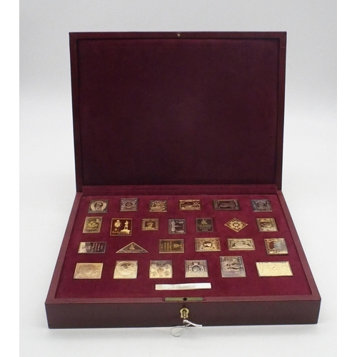 427 - A cased set of silver gilt stamp ingots of the British Empire, by Hallmark Replicas Ltd, 471gms