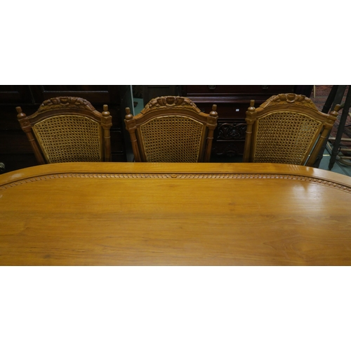 100 - A 20th century Indonesian hardwood dining table and eight chairs, dining table with shaped top on tw... 