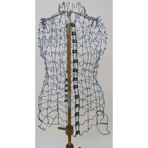 109 - A mid 20th century wire form dress makers mannequin on adjustable pine tripod base, 157cm high