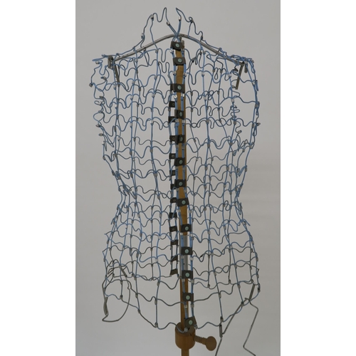 109 - A mid 20th century wire form dress makers mannequin on adjustable pine tripod base, 157cm high