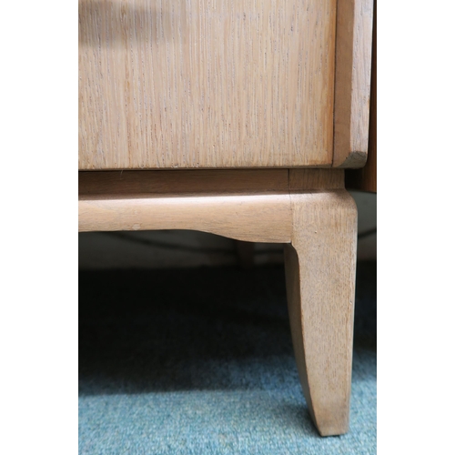 63 - A mid 20th century teak Link chest of four drawers with brass drawer pulls on shaped supports, 94cm ... 