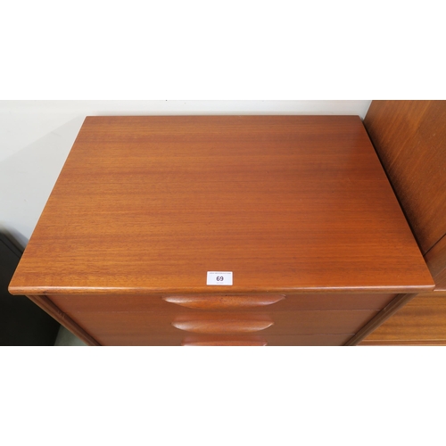 69 - A mid 20th century teak tall boy six drawer chest with shaped drawer pulls on plinth base, 115cm hig... 