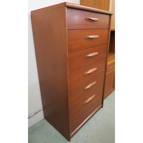 69 - A mid 20th century teak tall boy six drawer chest with shaped drawer pulls on plinth base, 115cm hig... 