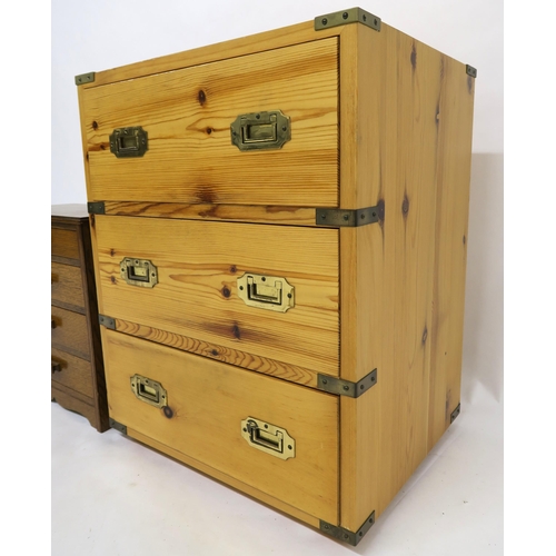 79 - A 20th century pine campaign style three drawer chest with brass corners and recessed handles, 64cm ... 