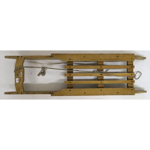 99 - A 20th century Murray & Baldwin Ltd sled, 131cm long x 36cm wide