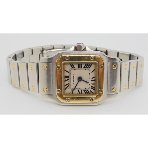 2900 - A LADIES CARTIER SANTOS GALBEE WATCHin gold and stainless steel, with cream dial, black Roman numera... 