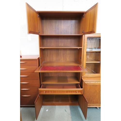 84 - A 20th century teak McIntosh secretaire bookcase with pair of cabinet doors over fall front writing ... 