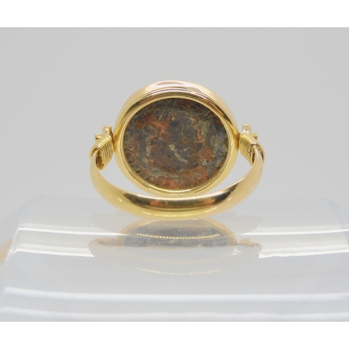 713 - A 14k gold ring set with an 'Of the Antique coin' size approx O1/2