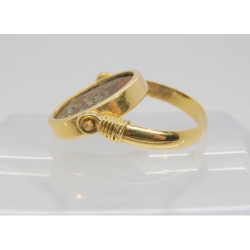 713 - A 14k gold ring set with an 'Of the Antique coin' size approx O1/2