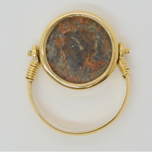 713 - A 14k gold ring set with an 'Of the Antique coin' size approx O1/2