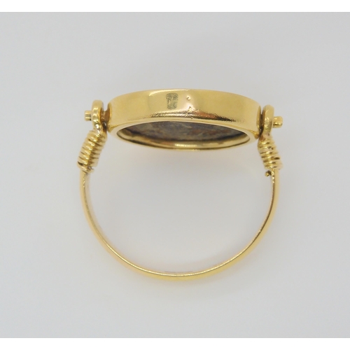 713 - A 14k gold ring set with an 'Of the Antique coin' size approx O1/2