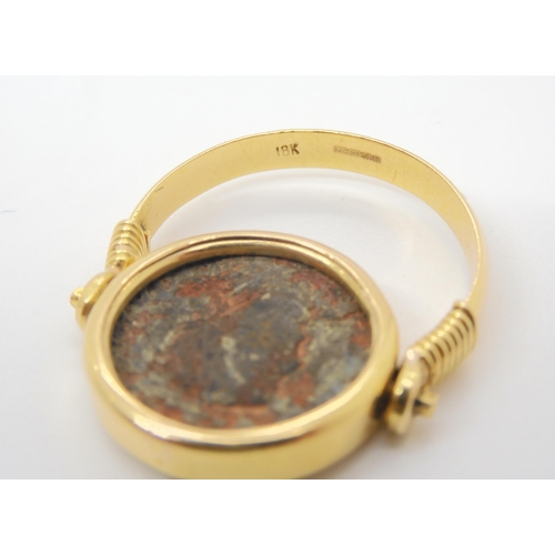 713 - A 14k gold ring set with an 'Of the Antique coin' size approx O1/2