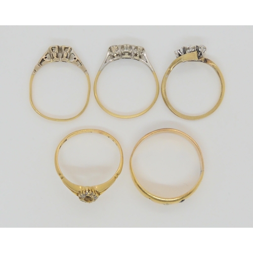 725 - Four 18ct rings and one in yellow metal, four are diamond set, together with a clear gem three stone... 