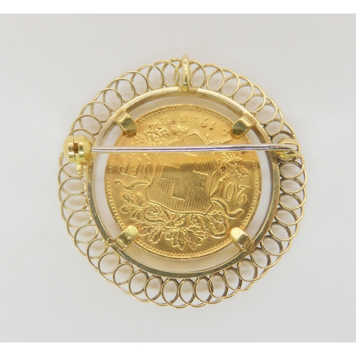 732 - A 1935 Swiss Helvetia 20 Franc coin in a yellow metal brooch mount, weight all together 10.5gms