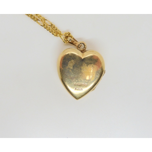 740 - A 14k gold curb link chain, length 68cm, weight 9.8gms, together with a 9ct heart shaped locket and ... 