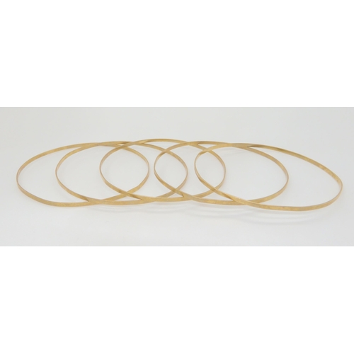 741 - A set of five 9ct gold bangles, weight together 18.2gms