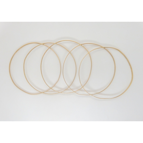 741 - A set of five 9ct gold bangles, weight together 18.2gms