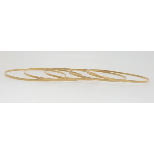 741 - A set of five 9ct gold bangles, weight together 18.2gms