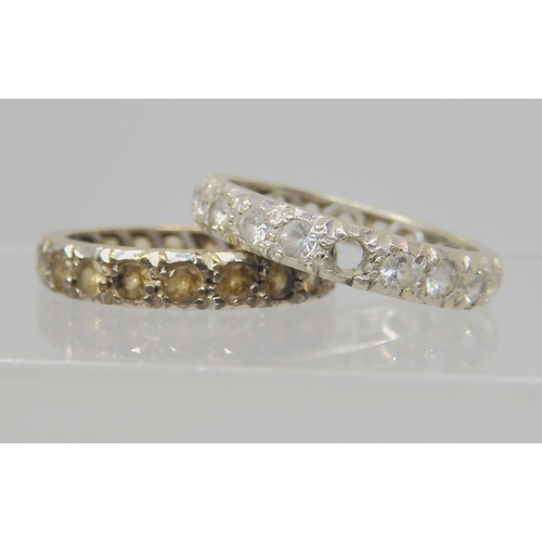 746A - Two 9ct white gold clear gem set eternity rings, sizes O & O1/2, weight 5.8gms