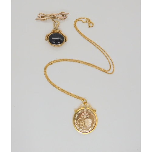 756 - A 9ct gold David Scott Walker, double sided fob seal, mounted on a 9ct brooch, together with a Charl... 