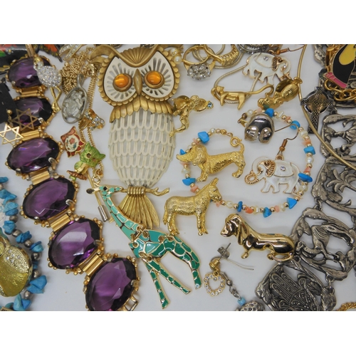 761 - A large owl pendant, together with a collection of animal brooches, a Lorus Mickey Mouse watch etc