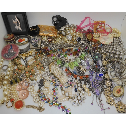 762 - A large box full of costume jewellery to include mirror compacts, statement necklaces etc