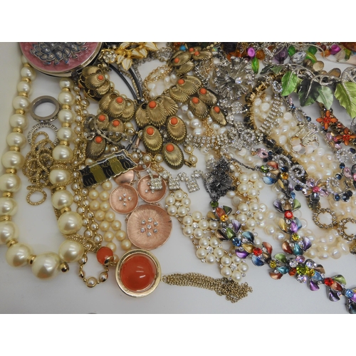 762 - A large box full of costume jewellery to include mirror compacts, statement necklaces etc