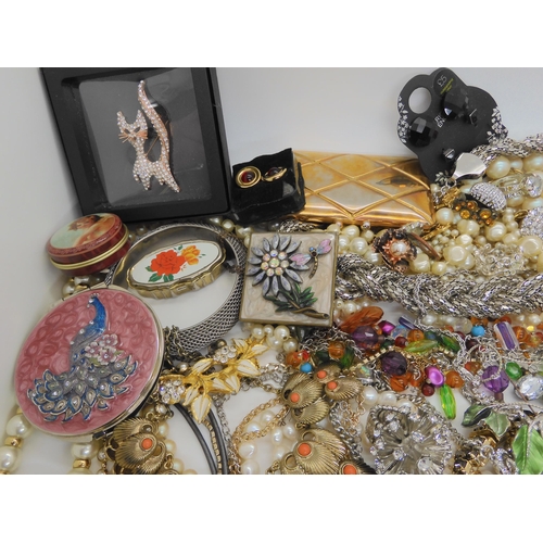 762 - A large box full of costume jewellery to include mirror compacts, statement necklaces etc