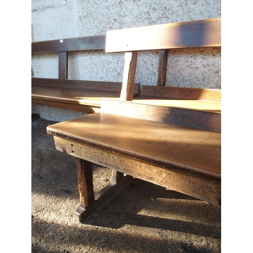 109 - A pair of early 20th century beech bench/pews with plain back on chamfered square supports, 79cm hig... 