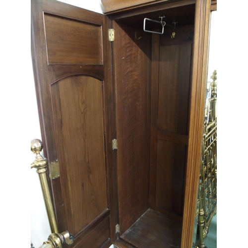 118 - A Victorian mahogany wardrobe with central mirror flanked by doors over two drawers, 201cm high x 15... 