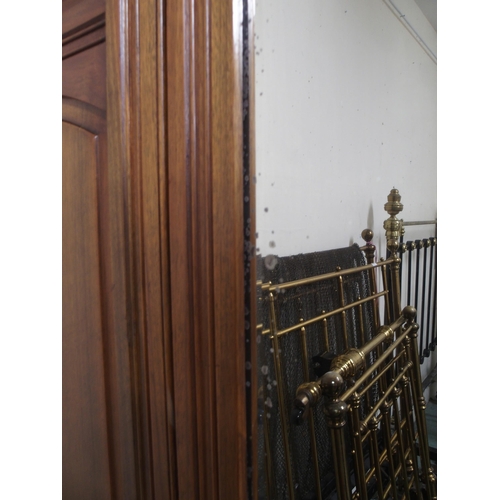 118 - A Victorian mahogany wardrobe with central mirror flanked by doors over two drawers, 201cm high x 15... 