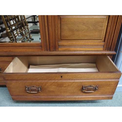 118 - A Victorian mahogany wardrobe with central mirror flanked by doors over two drawers, 201cm high x 15... 