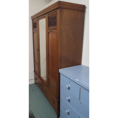 118 - A Victorian mahogany wardrobe with central mirror flanked by doors over two drawers, 201cm high x 15... 