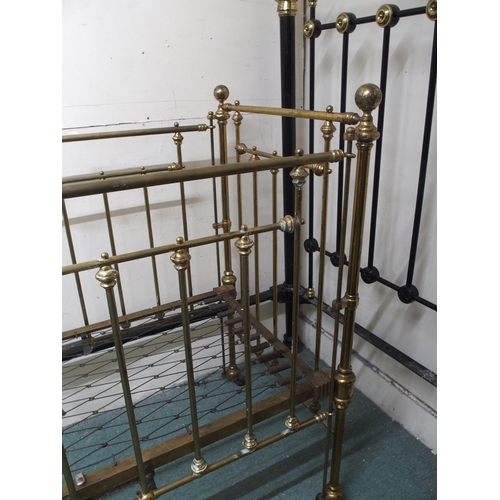 122 - A Victorian brass framed children's crib with drop sides, 117cm high x 68cm wide x 133cm long