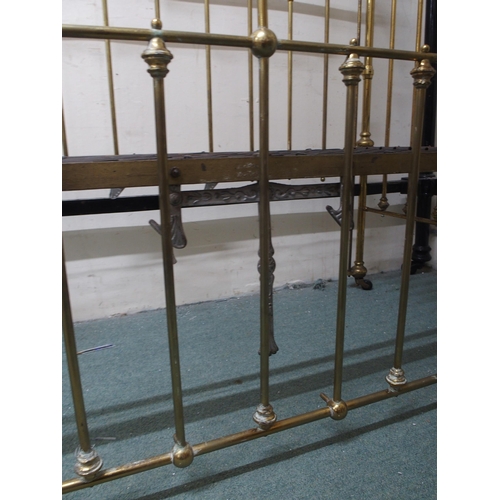 122 - A Victorian brass framed children's crib with drop sides, 117cm high x 68cm wide x 133cm long