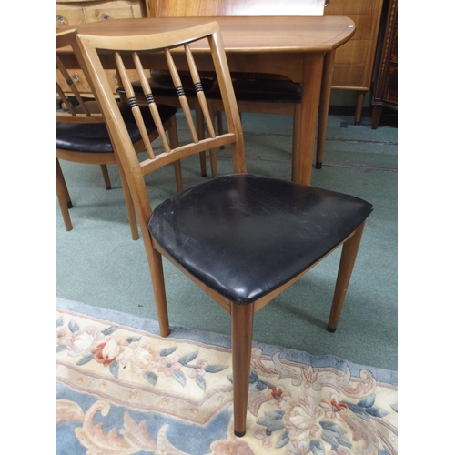 130 - A mid 20th century dining suite comprising stained teak extending dining table, 77cm high x 135cm lo... 