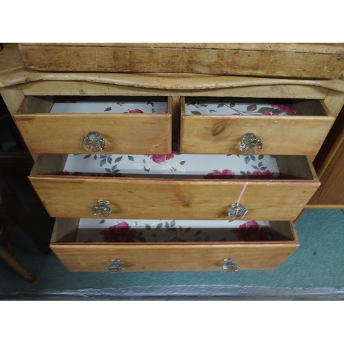 131 - A Victorian pine serpentine chest of three drawers with glass drawer pulls, 86cm high x 95cm wide x ... 