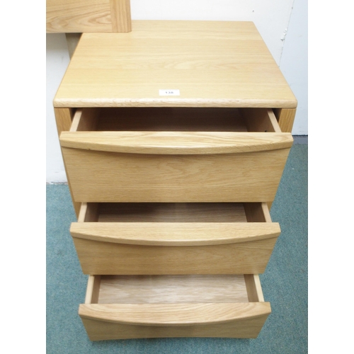 138 - A pair of contemporary beech Ercol three drawer bedside chests and a bergere headboard (3)