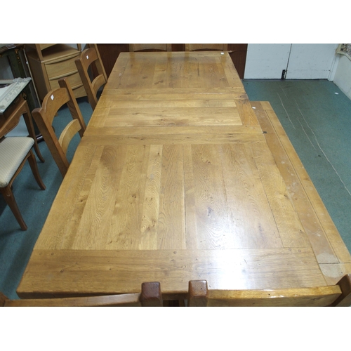 144 - A 20th century oak extending refectory style dining table, 75cm high x 190cm long (230cm extended) x... 