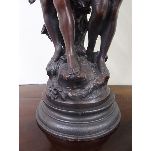 30 - A 20th century spelter figural table lamp with three floral moulded glass shades, 84cm high